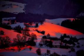 red backlit snow in the valley