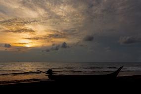 Boat on Beach Sea at sunset