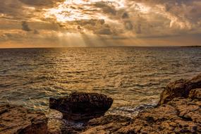 Rocky Coast at Sunset Sky Clouds