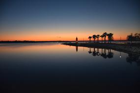 Lighthouse by the Lake at Sunrise