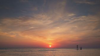 swim on SUP in the evening sea