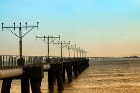 Bridge with lanterns by the sea