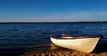 rowing boar on Lake shore, poland, Masuria