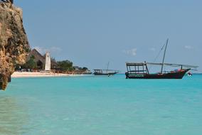 Boats on a tropical island backdrop