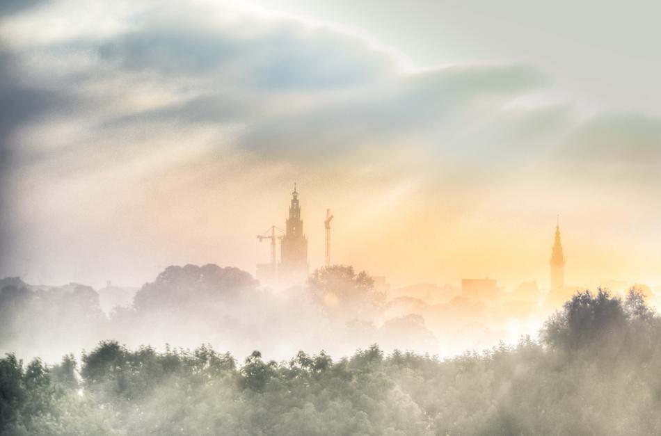 buildings in the morning fog in groningen, Holland