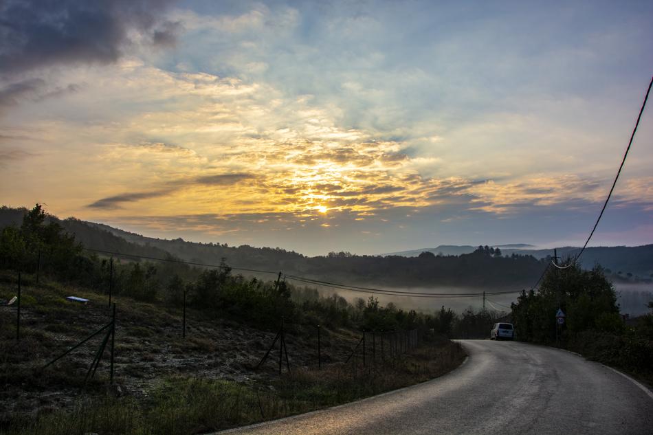 sunset over the road in the countryside