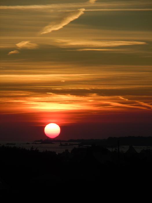 sunset in the evening sky over the landscapes of brittany