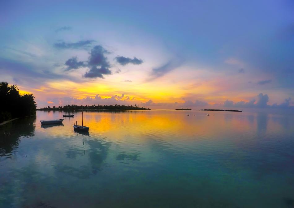 yellow sunset over calm waters in the tropics