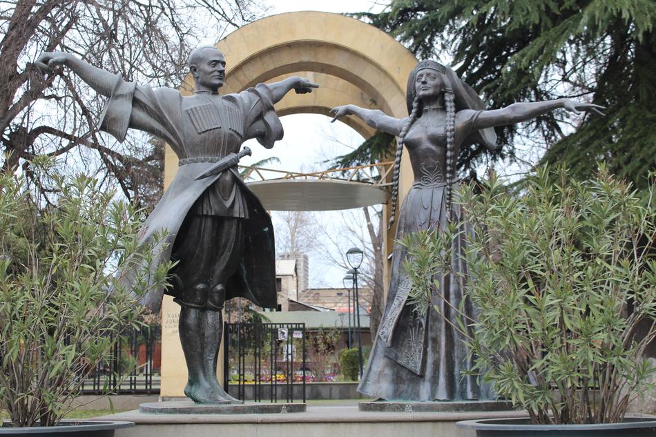 Sculptures of the people in the beautiful park with green plants, in Tbilisi, Georgia