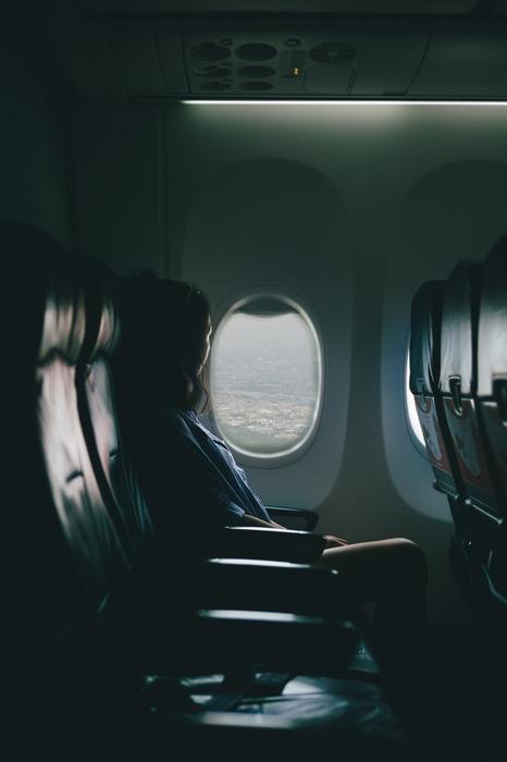 girl on the plane in the dark