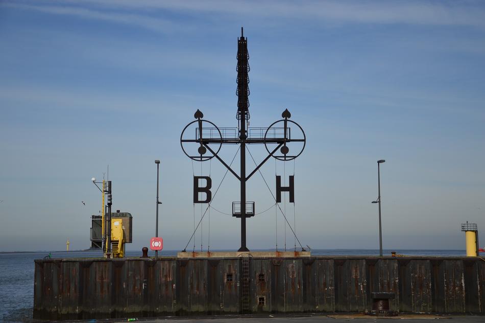 sign on the bridge near the north sea