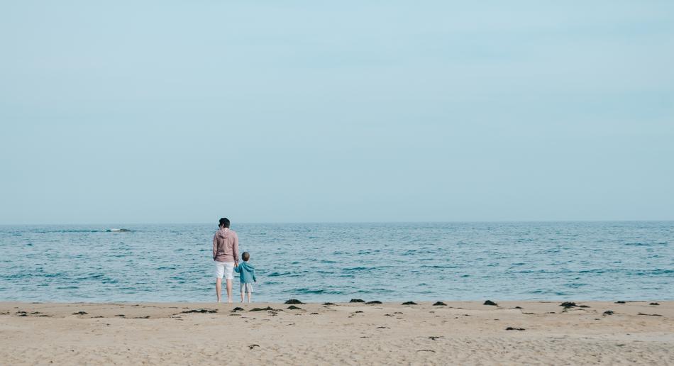 kid and father on Ocean Water shore
