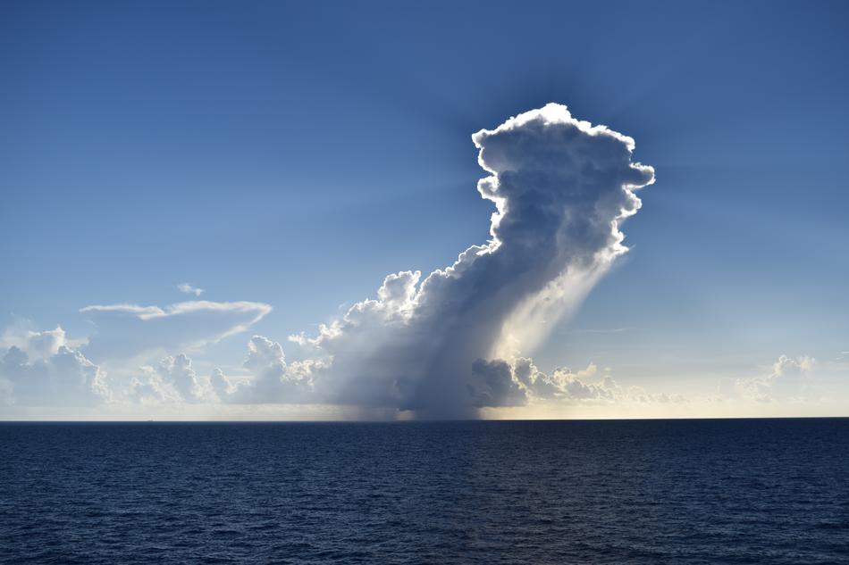 Beautiful clouds in the colorful sky above the water, on the view from Bahamas