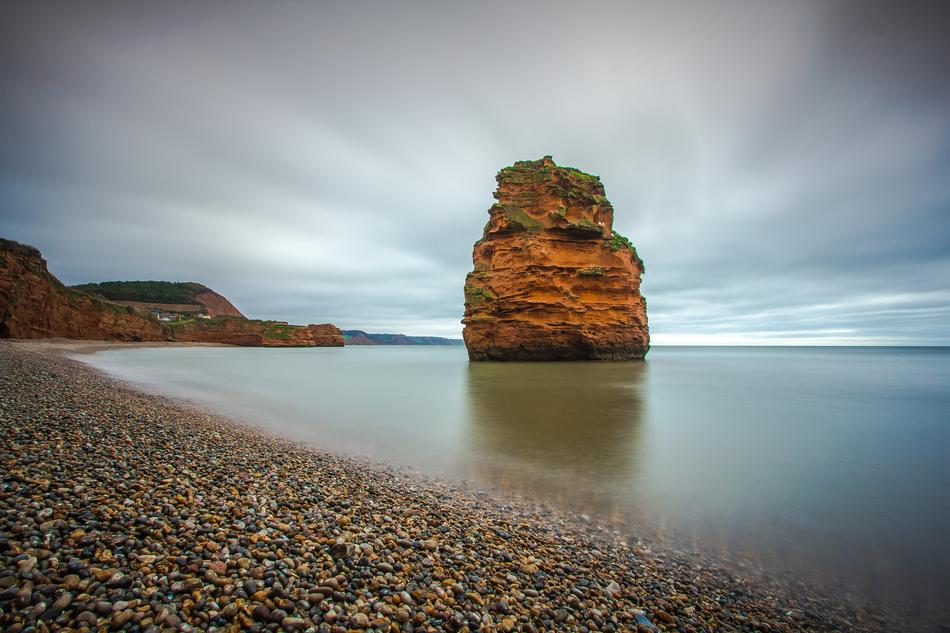 rock in the sea near the beach