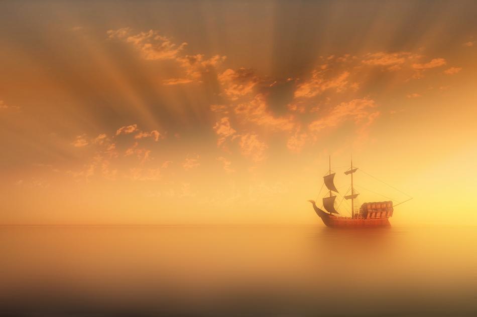 Waterscape with the ship in fog, at colorful and beautiful sunset