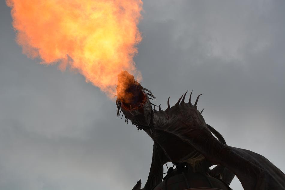 fire dragon on the background of the cloudy sky