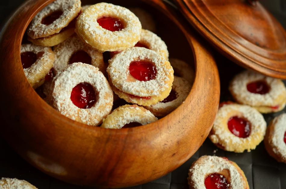 Beautiful Christmas cookies with red jam, in the wooden box