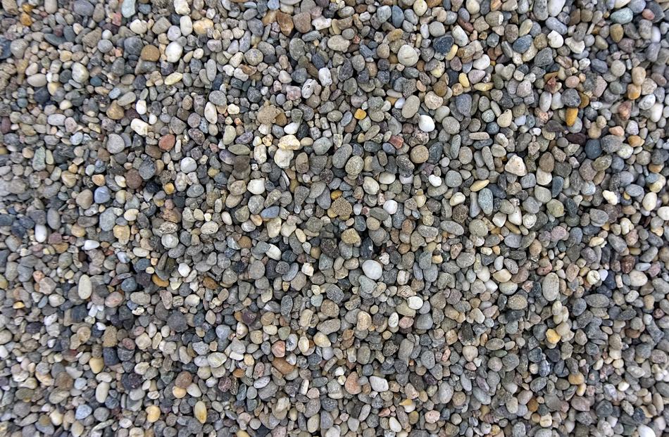 Colorful and beautiful pebbles as texture on the beach