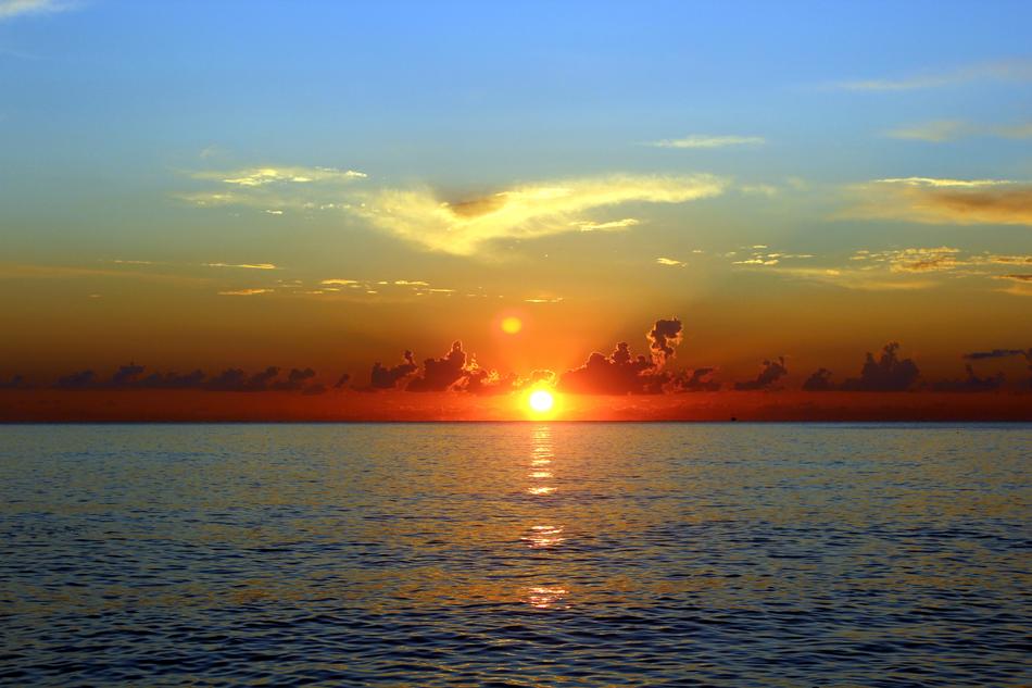 Beautiful waterscape of the sea, at colorful and beautiful sunset among the clouds