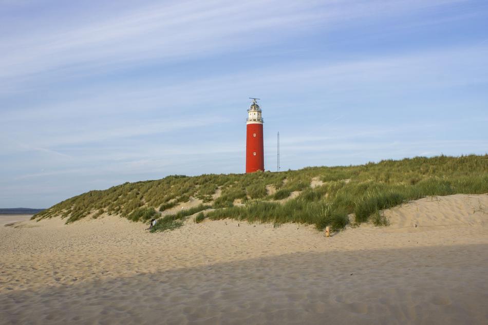 Lighthouse on sea Beach Dunes