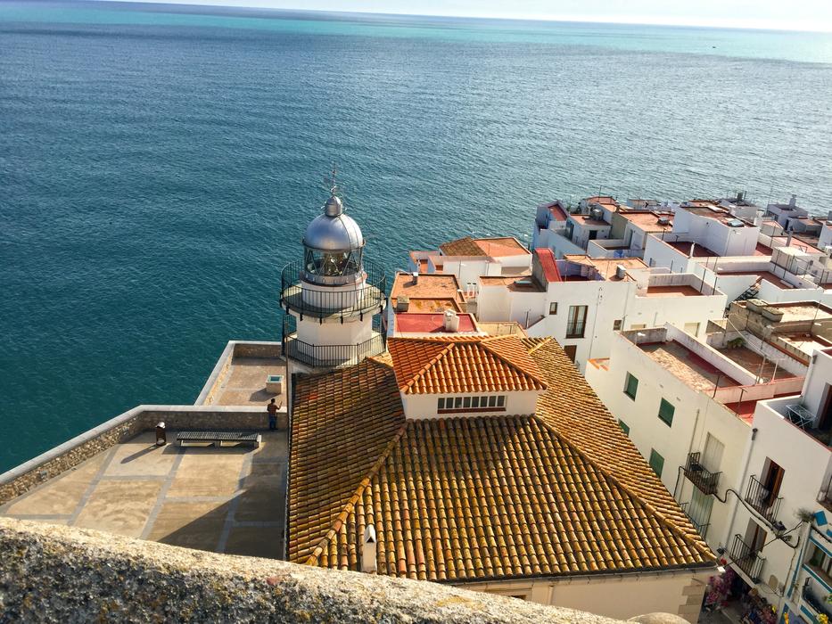 lighthouse and rooftops of buildings in Peniscola, Spain