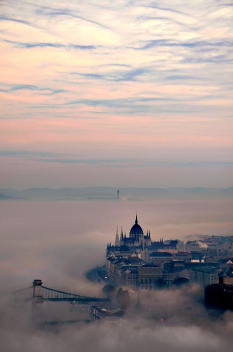 elizabeth bridge and parliament building in fog in Budapest
