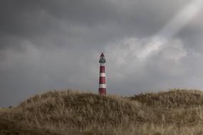 Lighthouse on hill coast