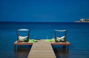 chairs on sea pier