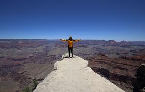 man standing on a rock