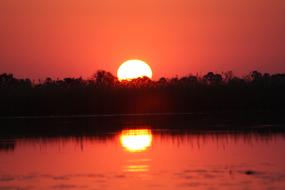 red Sunset over wilderness, Botswana