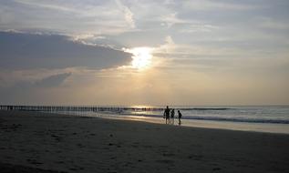 Sunset Sea Walk On The Beach
