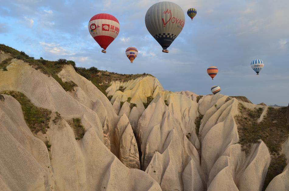 hot air balloons flight over mountains