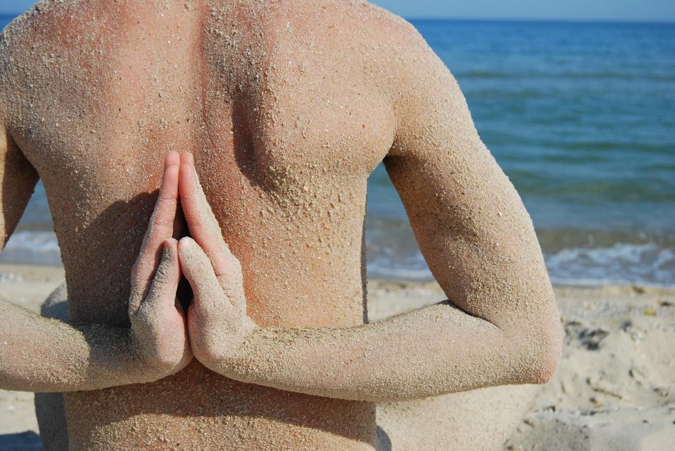 Yoga Fingers pose by the sea