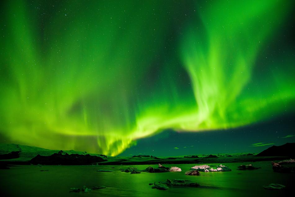 gorgeous Green borealis over ocean coast
