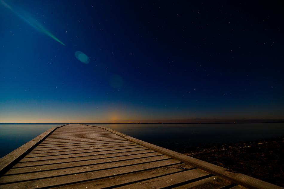 Starry night sky over the bridge