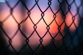 Dark Fence at Sunset