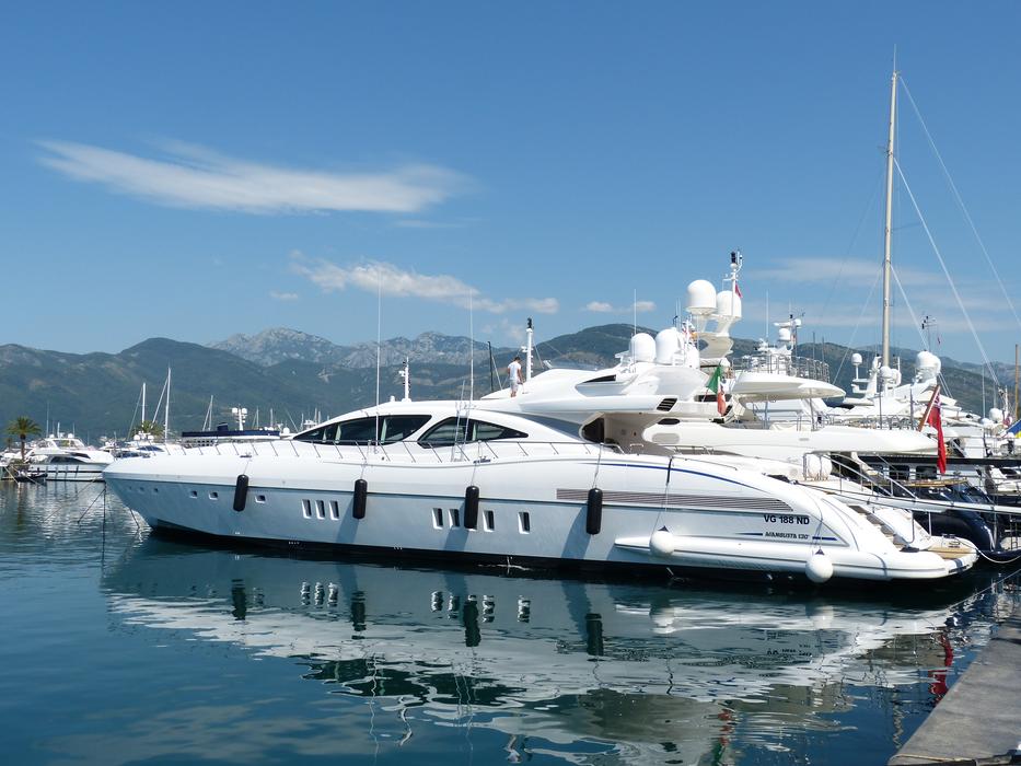 luxury yachts moored at pier in bay, Montenegro, Kotor
