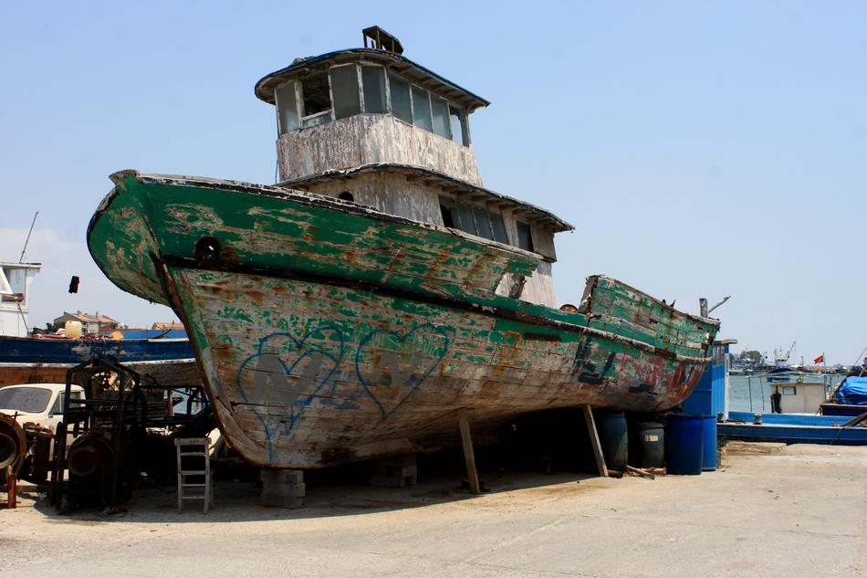 small old lapsed ship on beach