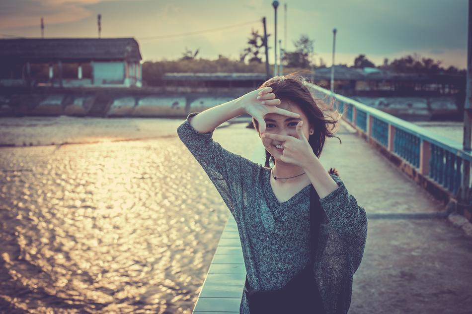 girl model on pier at sunset