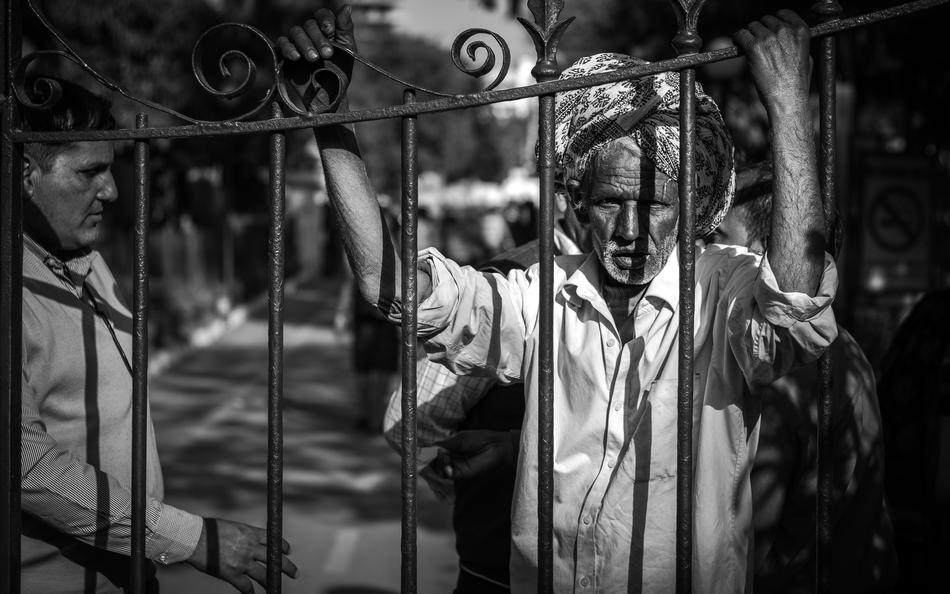 Beautiful picture of an old man at the fence