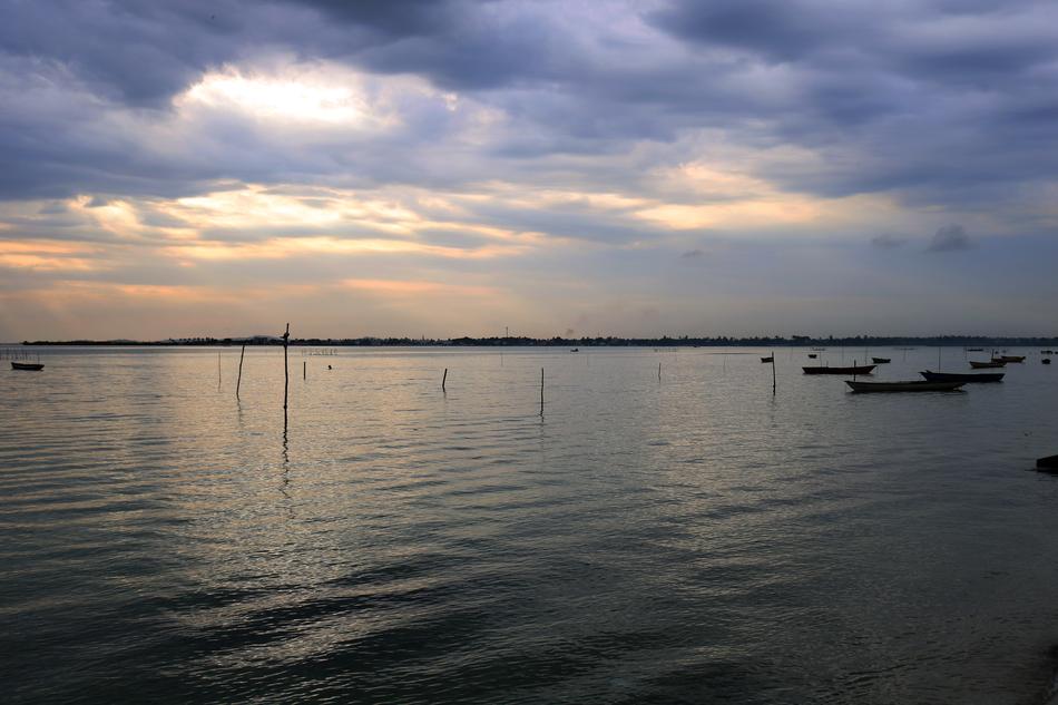 Beach with boats in the evening