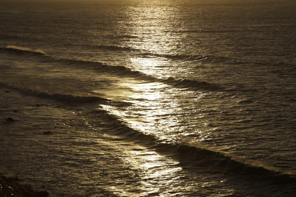 sea surface of water with a path of light