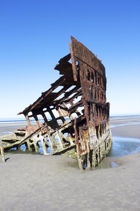 Rusty part of the ship left on the beach