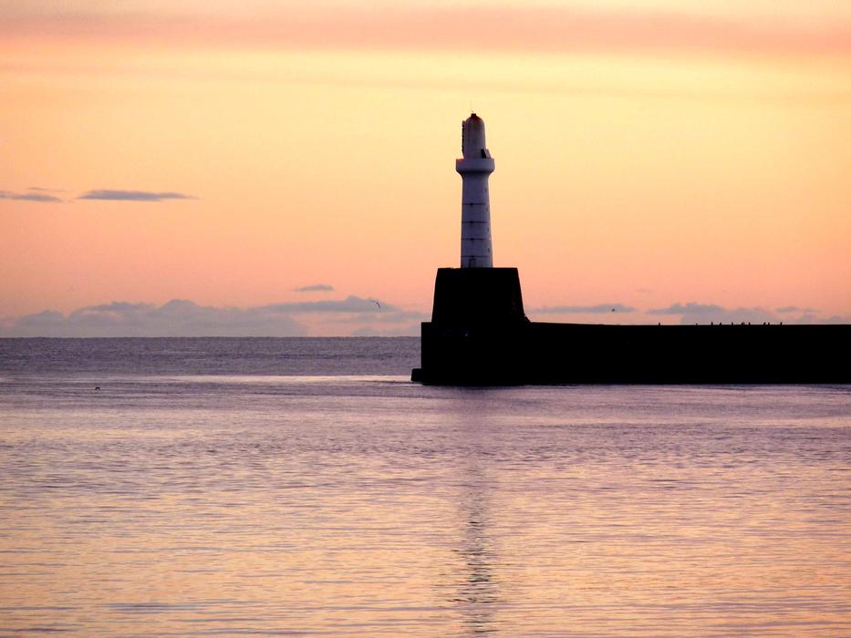 Lighthouse by the Waters Sea