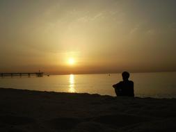 silhouette of a man against a sunny background