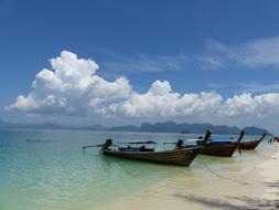 wooden boats on the ocean beach