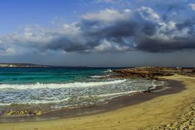 Waves washing the sandy beach