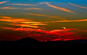 evening sunset with the silhouette of the mountains