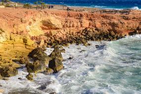 orange cliffs by the sea