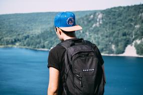 man with a backpack and a hat